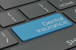 Photo of a keyboard with a dental insurance button